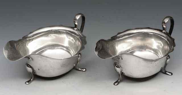 Appraisal: A PAIR OF SILVER SAUCE BOATS with marks for Sheffield