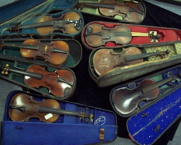 Appraisal: A quantity of violins in cases dilapidated condition