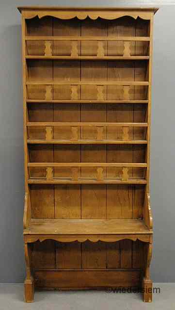 Appraisal: French pine open cupboard th c with a scalloped cornice