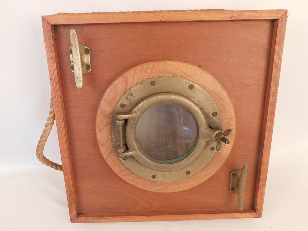 Appraisal: BRASS PORTHOLE WALL PLAQUE Old brass porthole wall plaque with