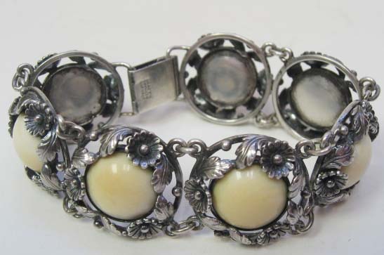 Appraisal: A Danish Sterling and Ivory Bracelet having floriform sterling links