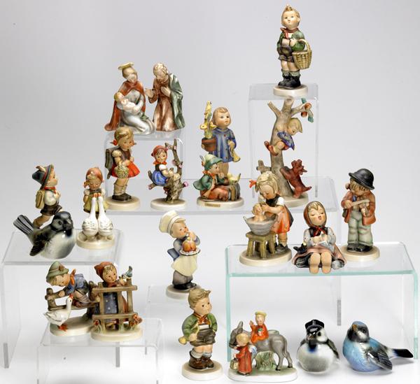 Appraisal: HUMMELS Goebels and Hummel-style figurines twenty-one pieces Tallest