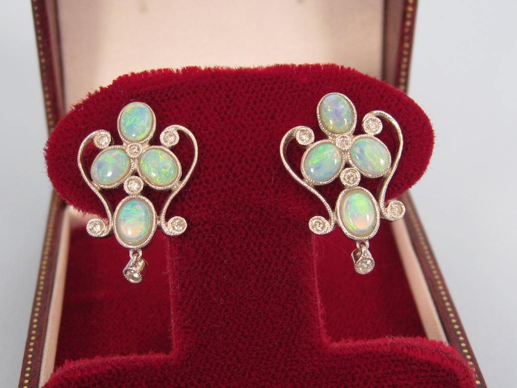 Appraisal: A pair of Continental Opal and Diamond Earrings each with