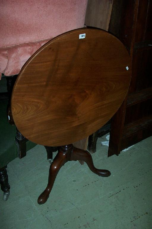 Appraisal: A Georgian mahogany snap-top occasional table the circular top raised