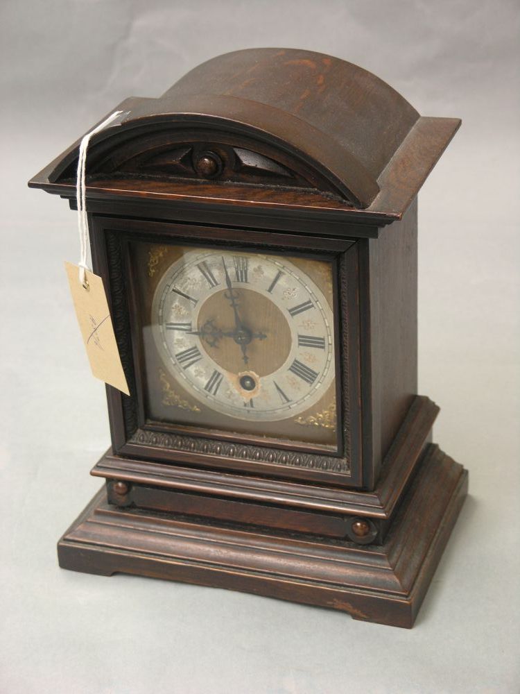 Appraisal: An early th century oak mantel clock traditional silvered dial