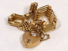 Appraisal: A carat gold five bar gate bracelet with matching padlock