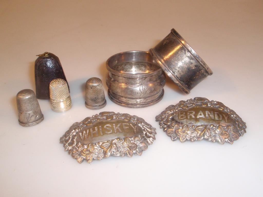 Appraisal: Two silver napkin rings three silver thimble and two plated