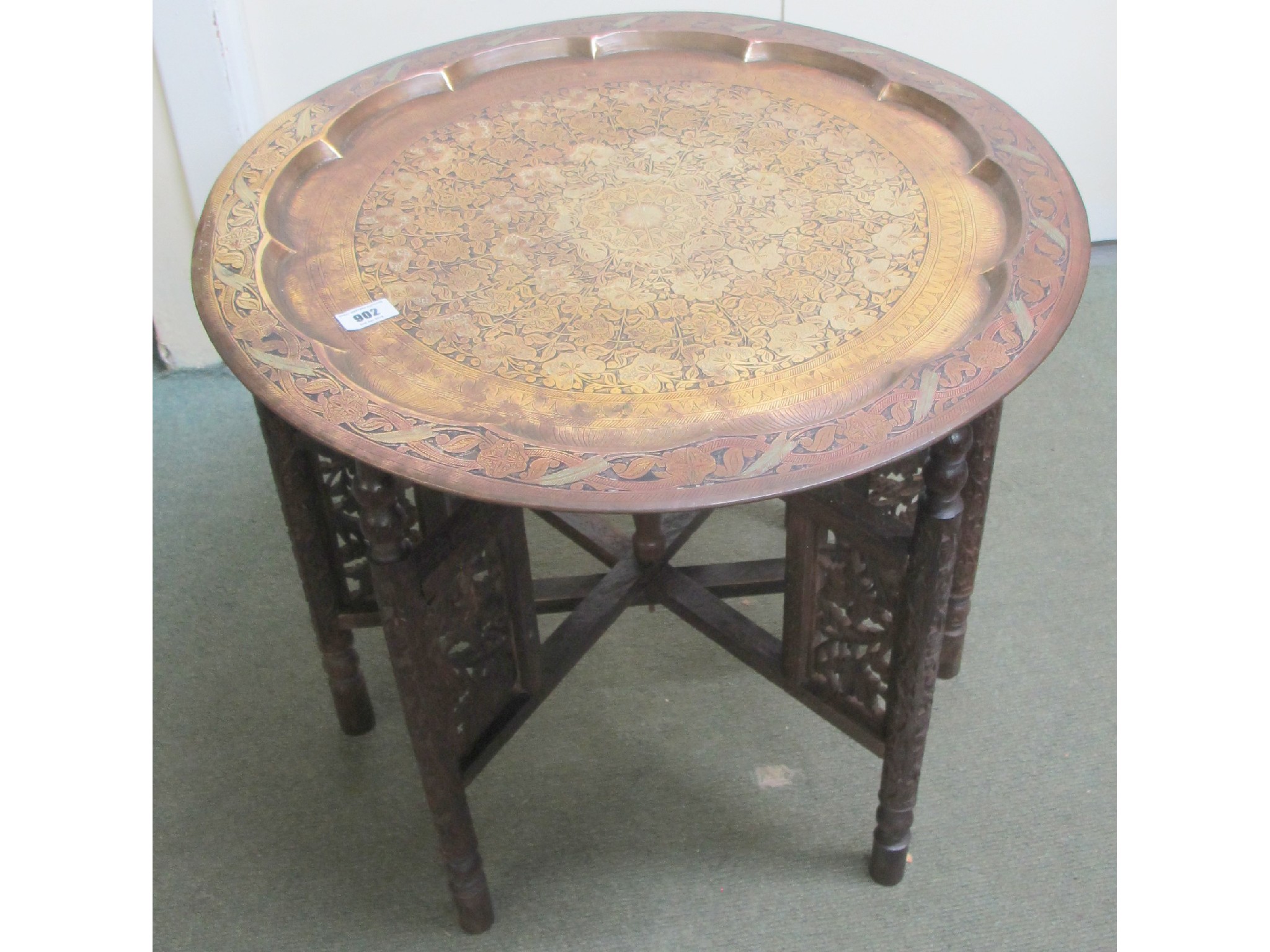 Appraisal: A brass Chinese occasional table