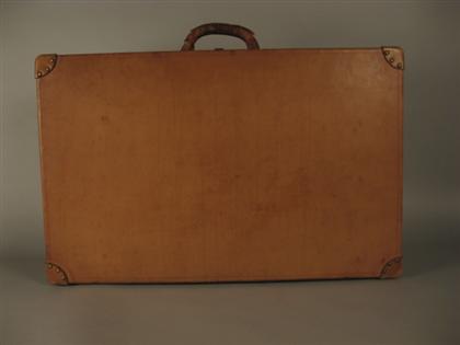 Appraisal: Louis Vuitton leather hard-sided suitcase th century Plain naturally tanned