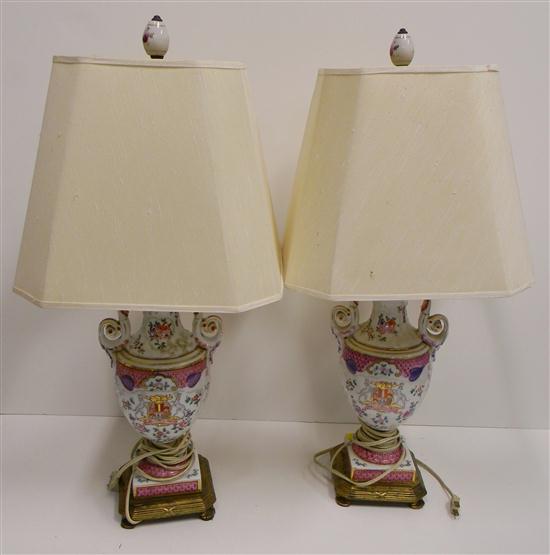 Appraisal: Two vasiform lamps with shield of arms and floral polychrome