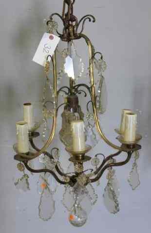 Appraisal: Gilt Metal Light Skeleton Form Chandelier From a Manhattan lighting