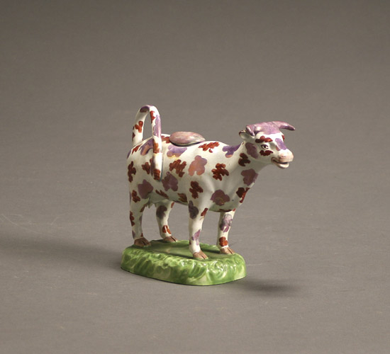 Appraisal: Staffordshire Pink Lustre and Polychrome Decorated Cow Creamer Circa Chip