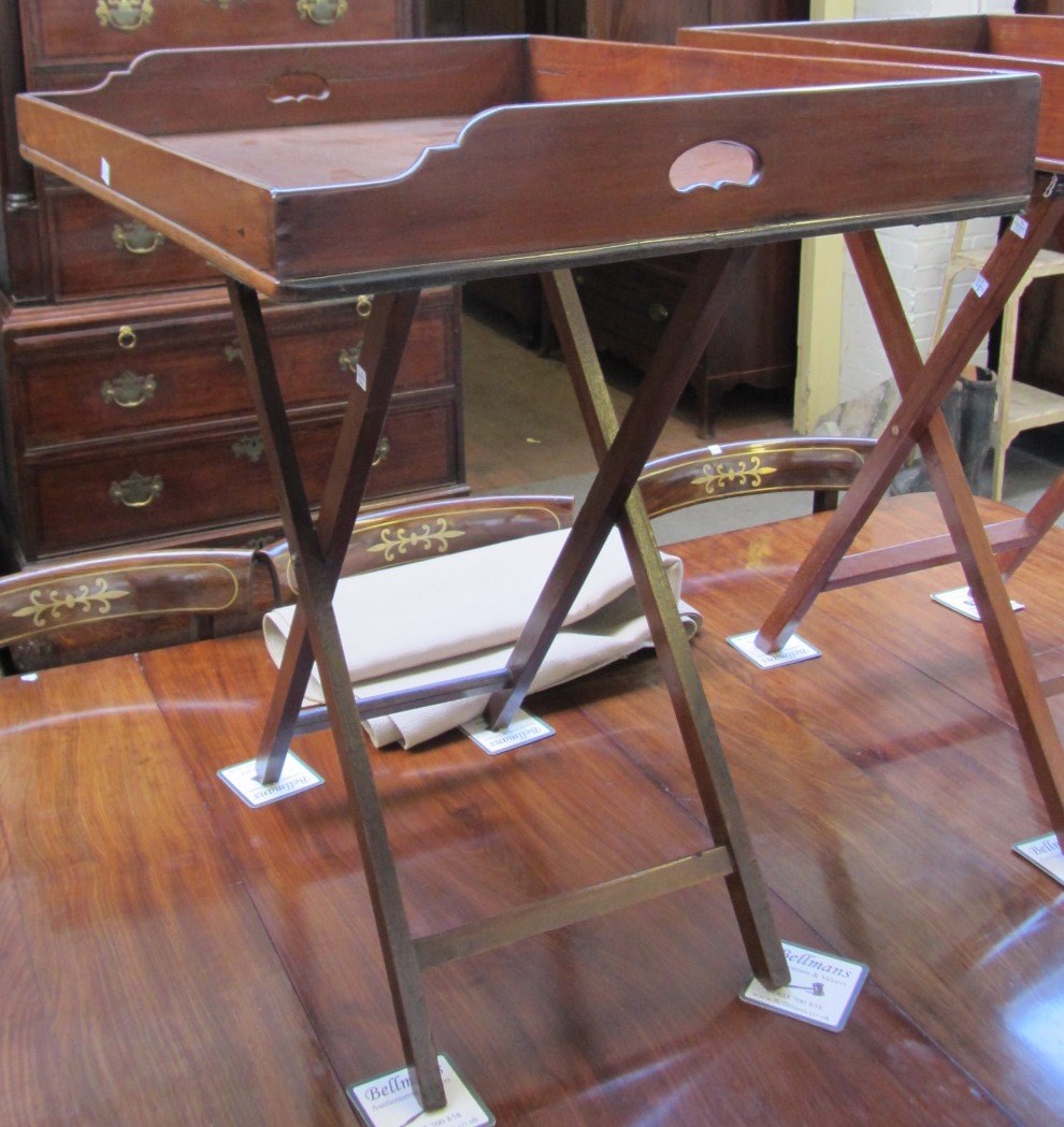 Appraisal: A George III mahogany butlers tray with loop handles on