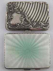 Appraisal: A silver engine turned cigarette case with green enamelled face