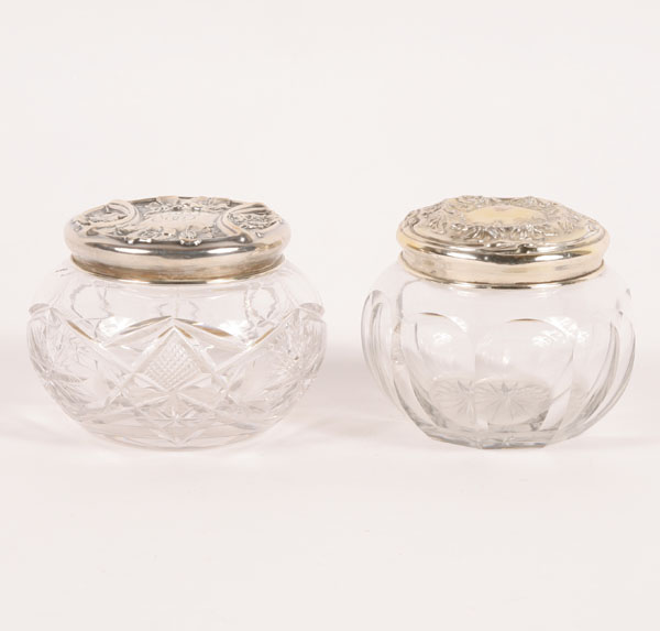 Appraisal: Two glass powder jars with sterling floral repousse lids One