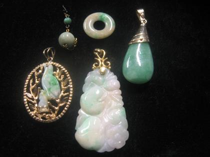 Appraisal: Group of four jade pendants In various carved and polished