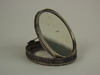 Appraisal: TRAVEL MIRROR - Early Persian oval folding travel mirror with