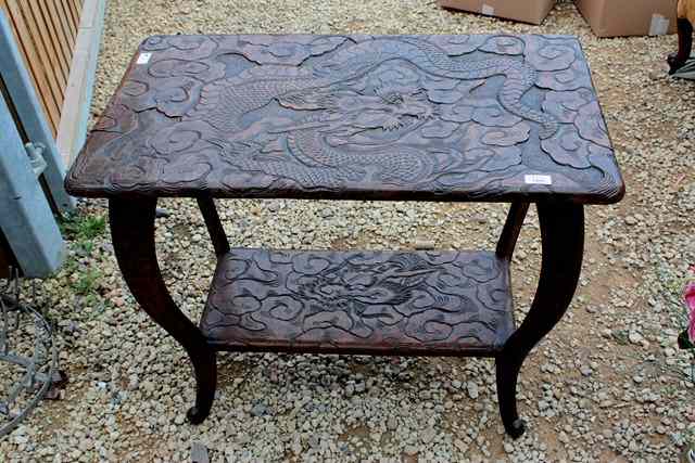 Appraisal: AN ORIENTAL CARVED WOOD RECTANGULAR TWO TIER OCCASIONAL TABLE with