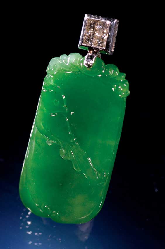 Appraisal: CARVED IMPERIAL JADE PENDANT Chinese carved emerald green Imperial jadeite