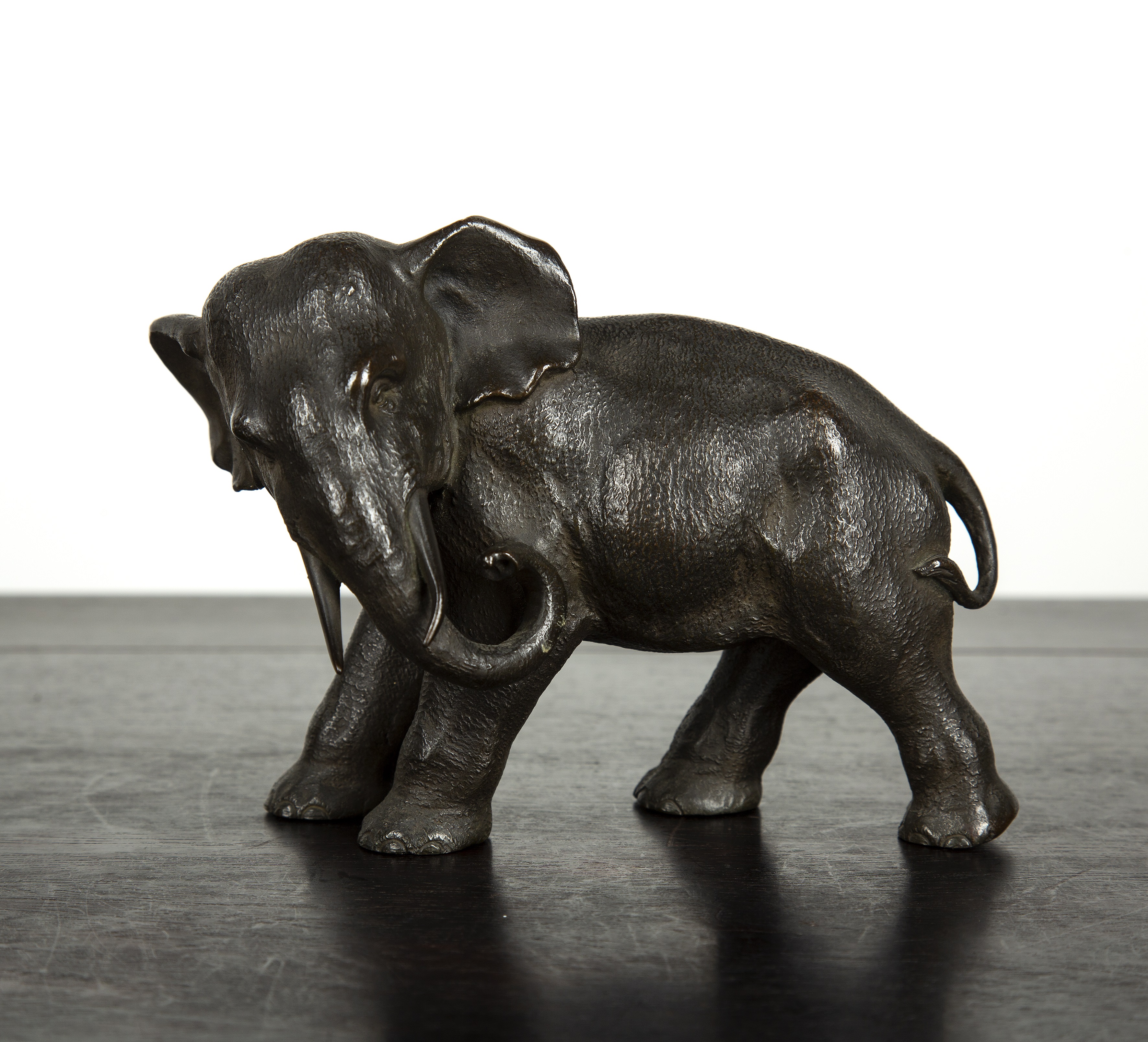 Appraisal: Bronze model elephant Japanese Meiji period with its head turned