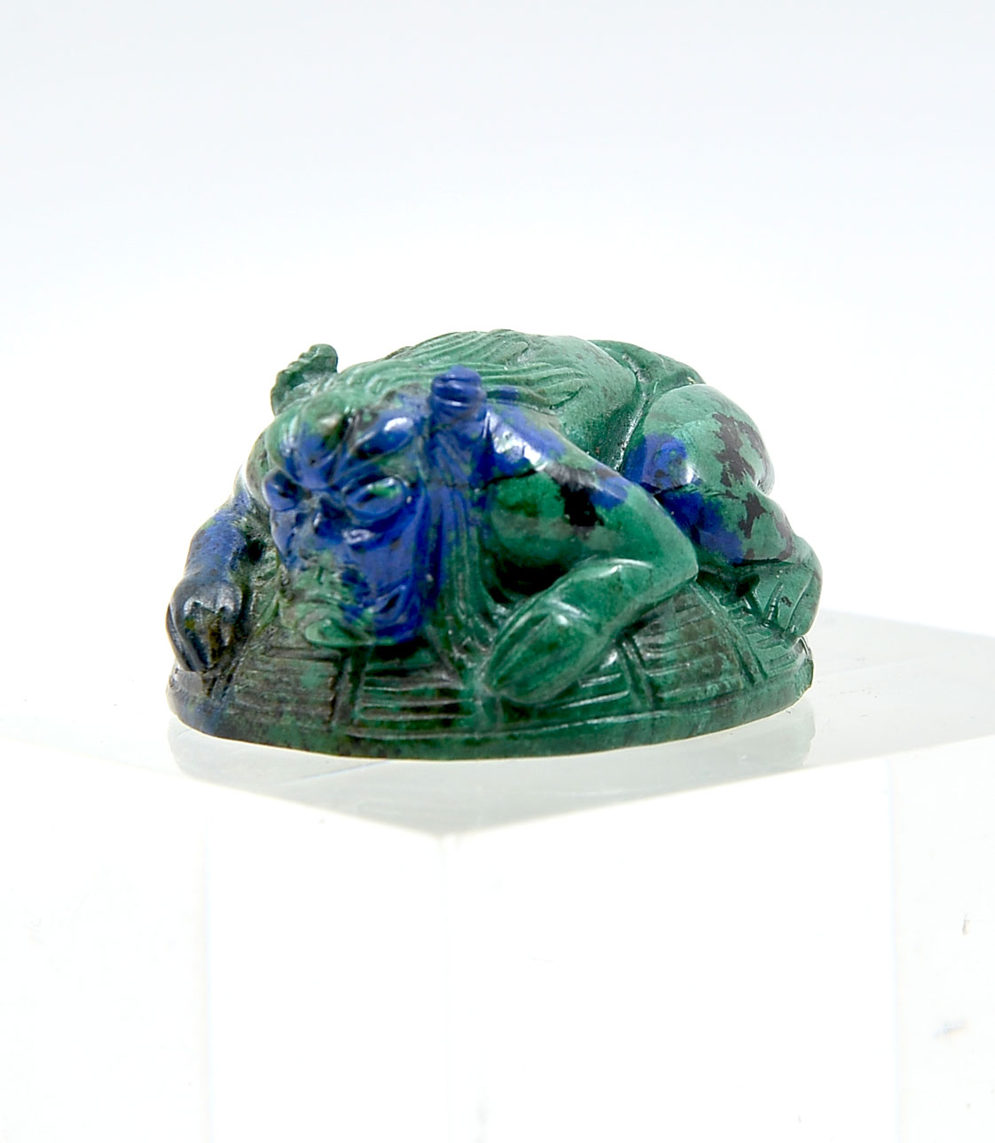 Appraisal: LAPIS AND MALACHITE DEMONIC CREATURE NETSUKE Japanese netsuke of Lapis