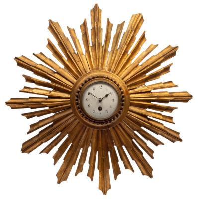 Appraisal: A th Century carved and gilt pine sunburst wall clock