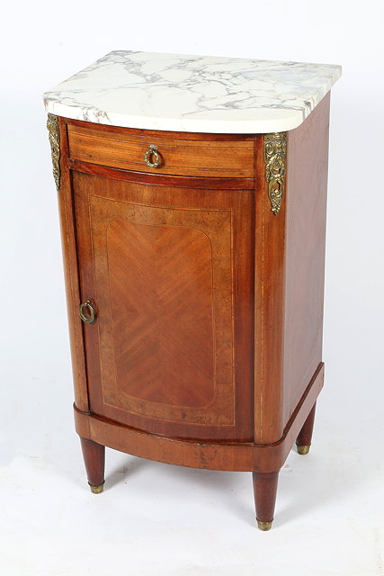 Appraisal: A MARBLE TOPPED CONTINENTAL WALNUT BOW FRONTED POT CUPBOARD iwht