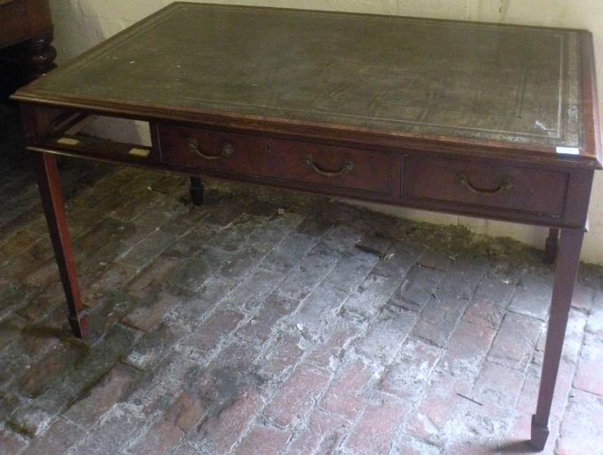 Appraisal: A thC mahogany library table with a one piece green