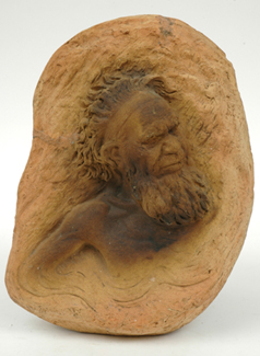 Appraisal: WILLIAM RICKETTS Earthenware plaque modelled as an Indigenous Australian elder