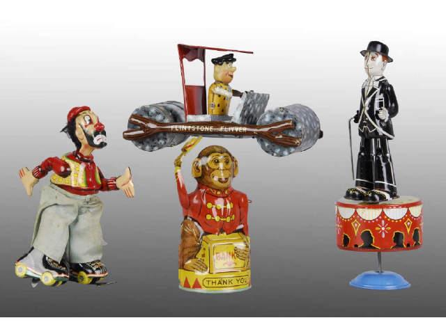 Appraisal: Lot of Character Tin Toys Description Wind-up Japanese clown skater