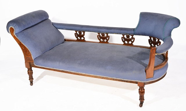 Appraisal: A VICTORIAN CARVED WALNUT CHAISE LONGUE having a scroll and