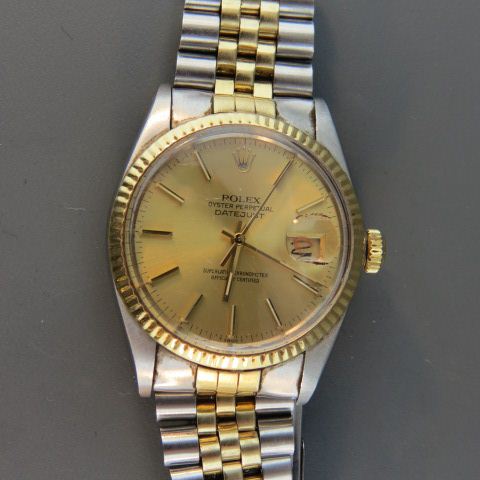 Appraisal: Rolex Man's Wristwatch stainless k gold champagne dial date dust