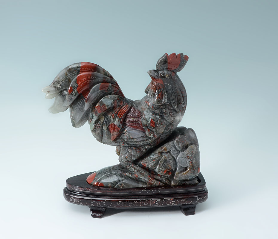 Appraisal: CHINESE CARVED JASPER ROOSTER ON STAND Carved brecciated jasper or