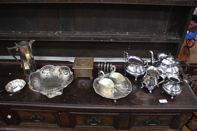 Appraisal: A SILVER PLATED THREE PIECE TEA SET together with a