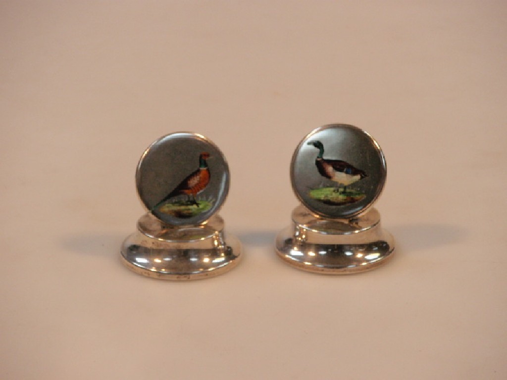 Appraisal: A pair of Edwardian silver menu holders one enamelled with