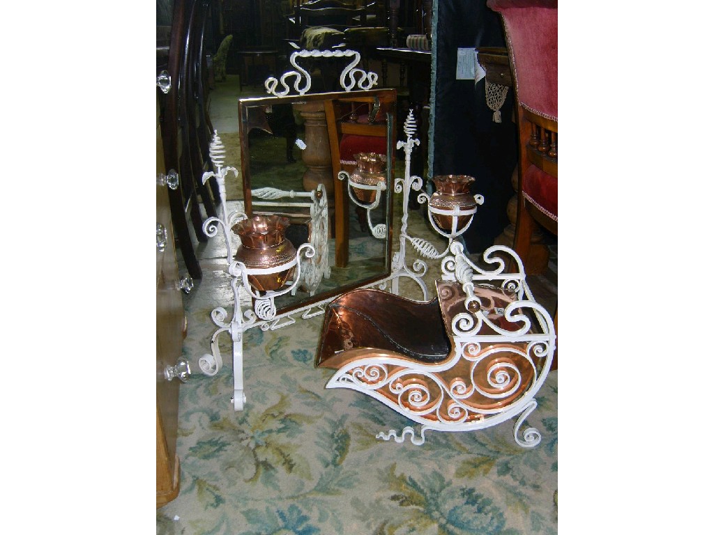 Appraisal: A decorative iron framed free standing fire screen with scroll