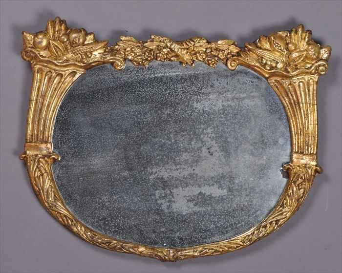 Appraisal: FEDERAL-STYLE CARVED GILTWOOD MIRROR The oval plate within a frame