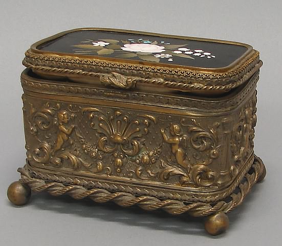 Appraisal: Band of scrollwork and fruit festoons with putti ropetwist border