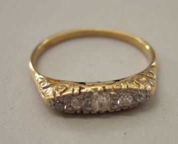 Appraisal: A gold and diamond set five stone ring mounted with