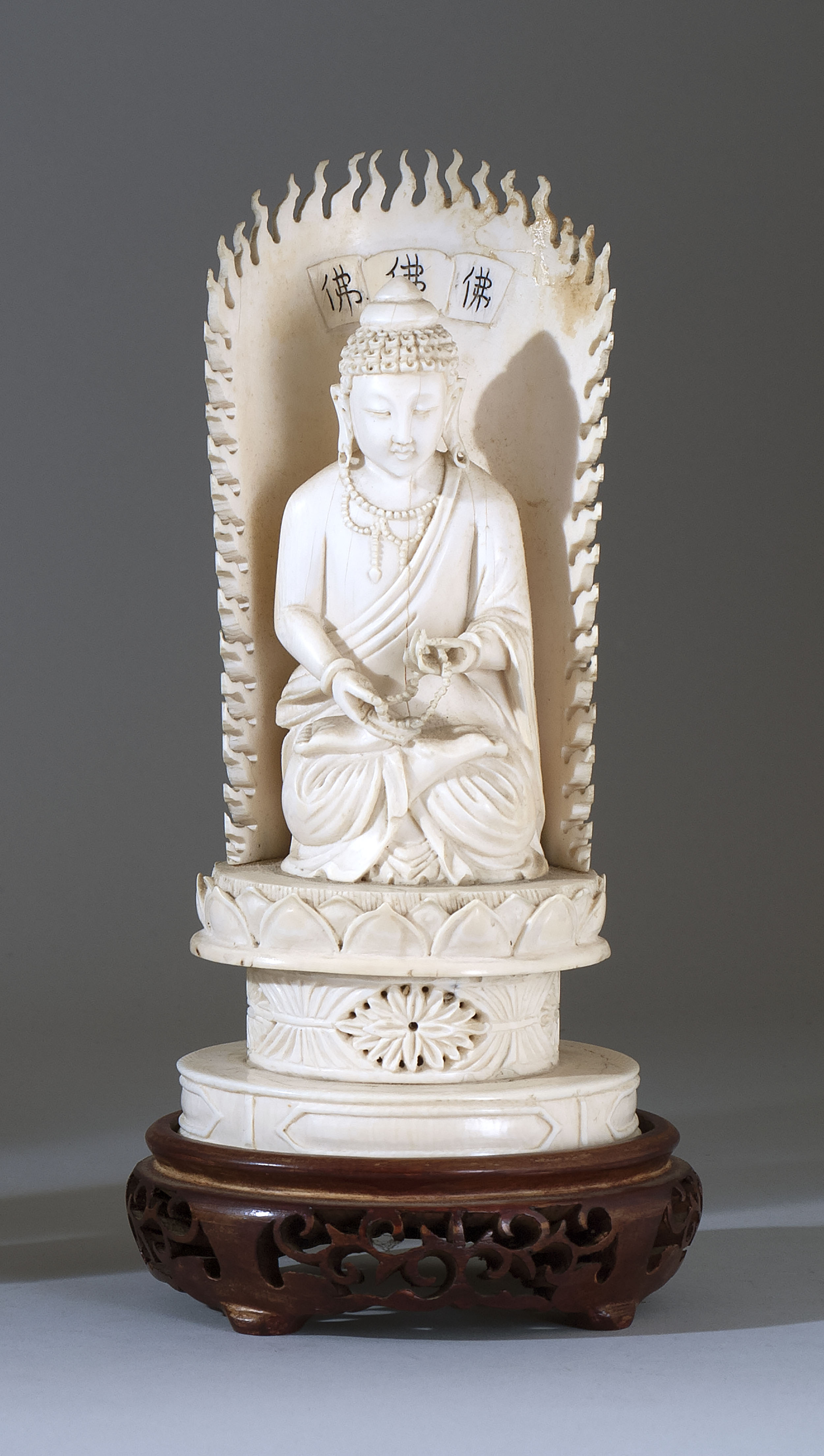 Appraisal: IVORY FIGURE OF A SEATED BUDDHA Late th Early th