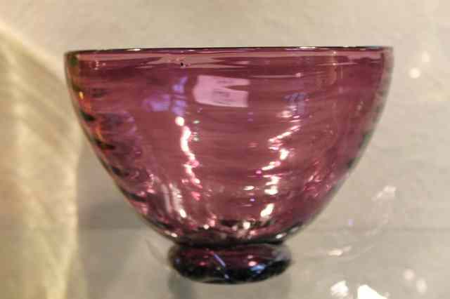 Appraisal: A WHITEFRIARS AMETHYST WAVE RIBBED BOWL circa designed by William