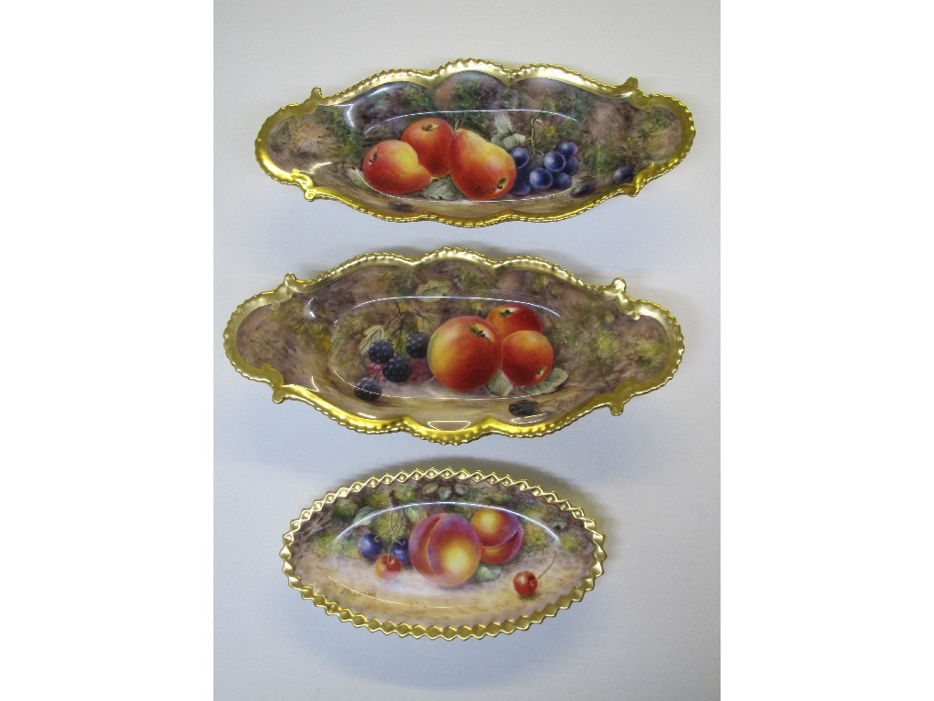 Appraisal: A pair of Royal Worcester oval shaped dishes painted with