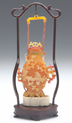 Appraisal: CHINESE SNUFF BOTTLES Four carved hornbill bottles one with attached