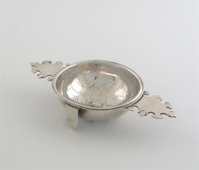 Appraisal: A George I strainer with two shaped lug handles a