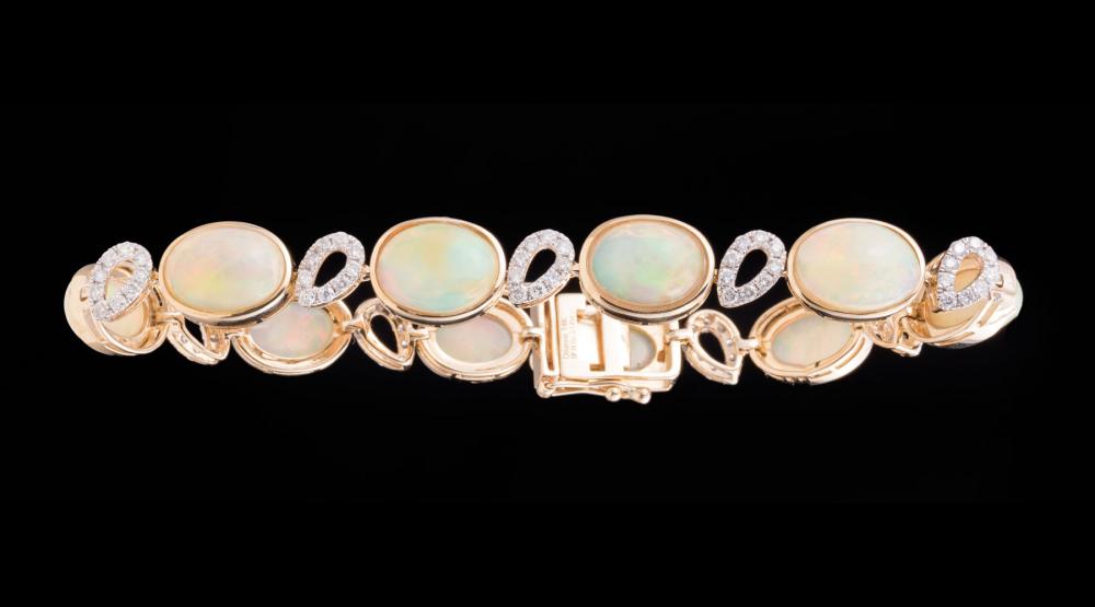 Appraisal: kt Yellow Gold Opal and Diamond Bracelet bezel set oval