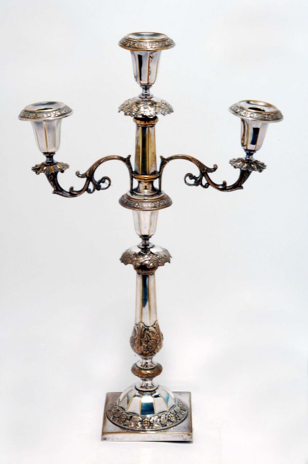 Appraisal: A silverplated brass lite candelabra Two part Paneled cups with