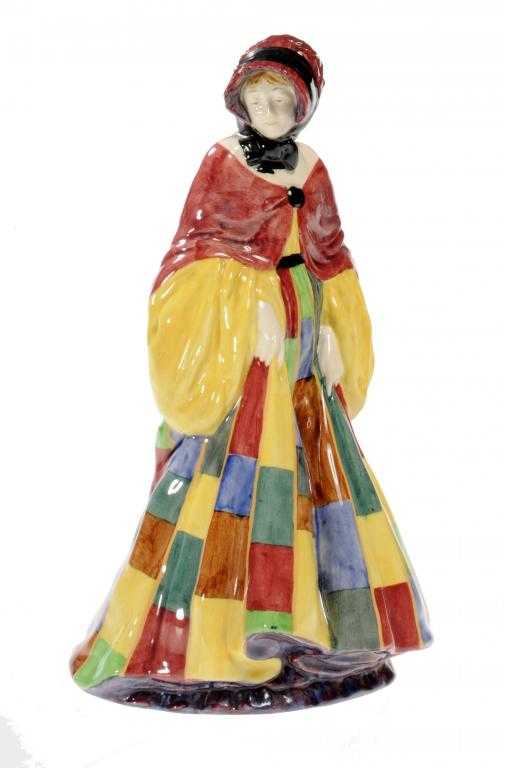 Appraisal: A ROYAL DOULTON EARTHENWARE FIGURE OF THE PARSON'S DAUGHTER MODELLED