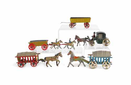 Appraisal: Four German tin lithograph horse drawn penny toys early th