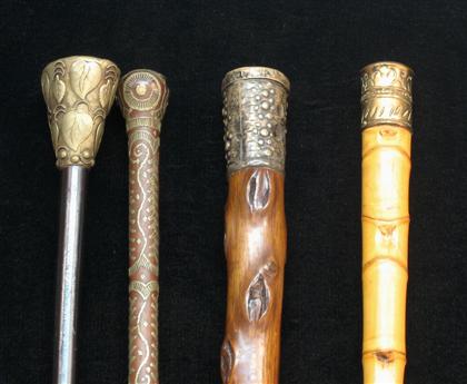 Appraisal: Group of four walking sticks with brass and silver plated