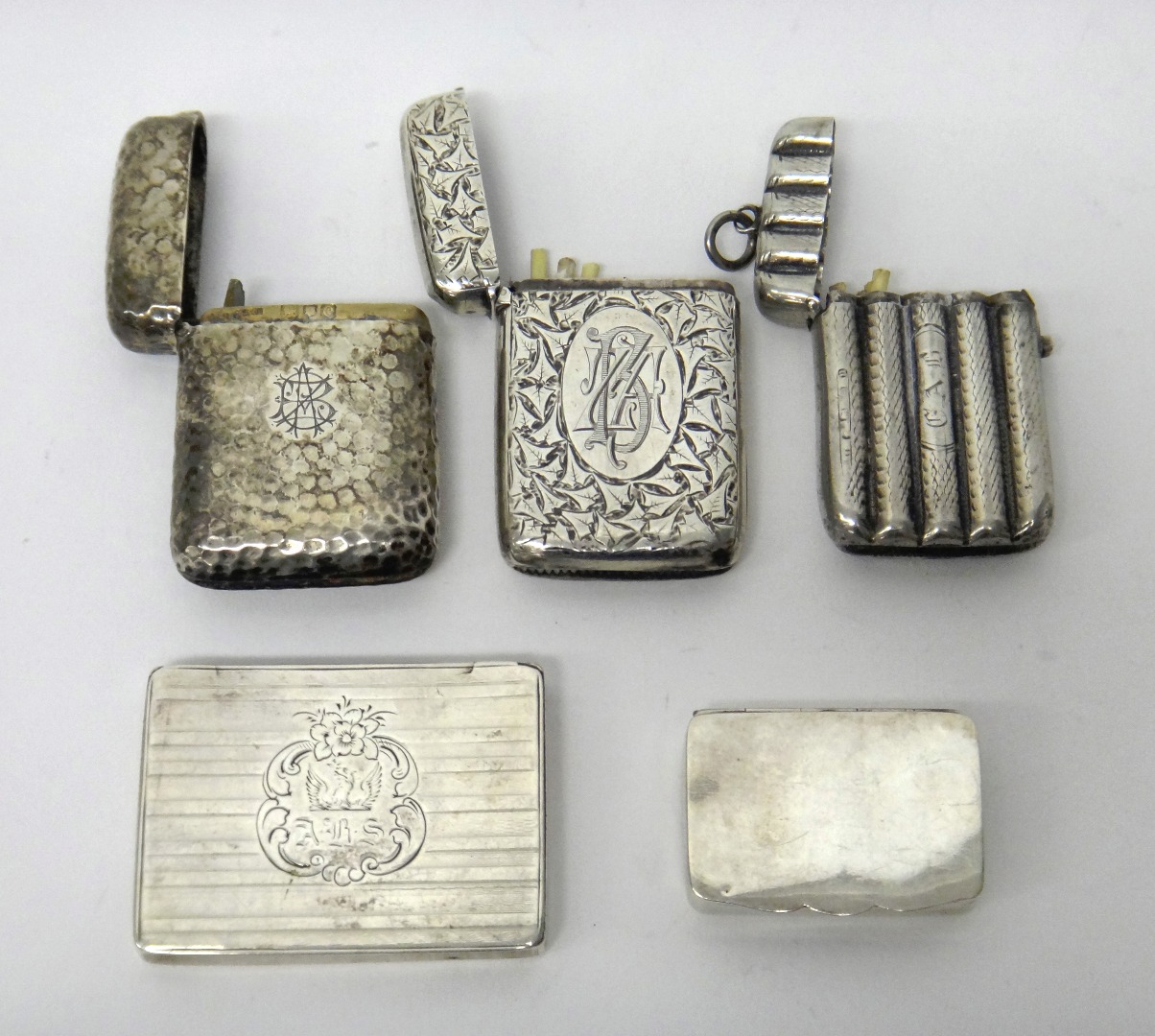 Appraisal: A silver vesta case of rectangular form with planished decoration